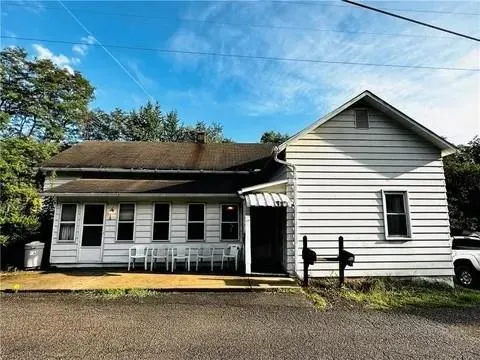 a house view with a garden space