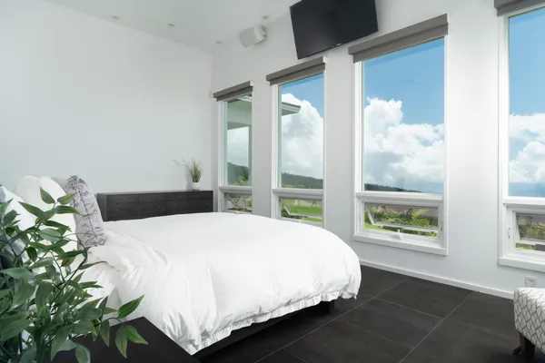 a bedroom with a bed and window
