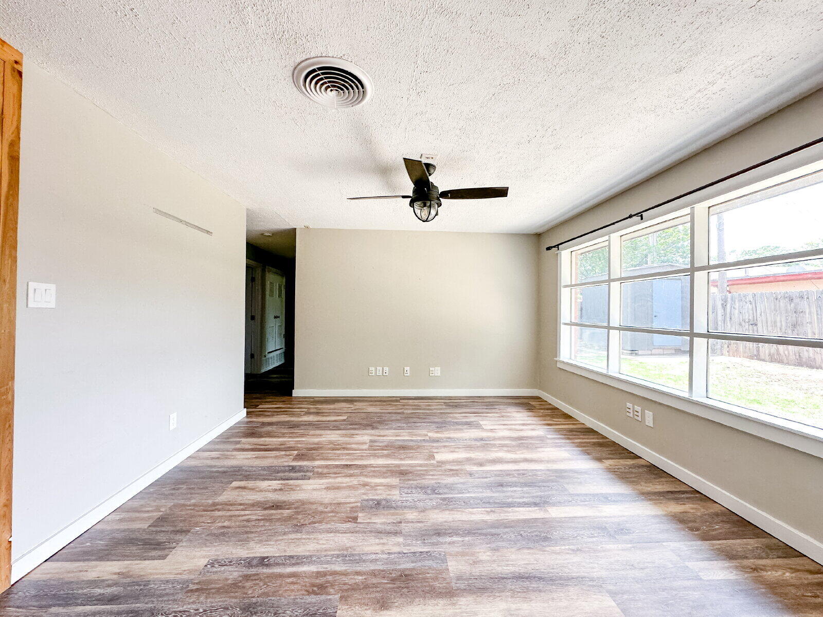 2608 Raleigh Avenue Lubbock, TX 79410 - Photo 14 of 23 a view of a livingroom with a dishwasher and a window