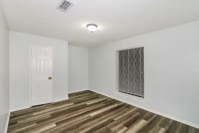 a view of a livingroom with a ceiling fan and window