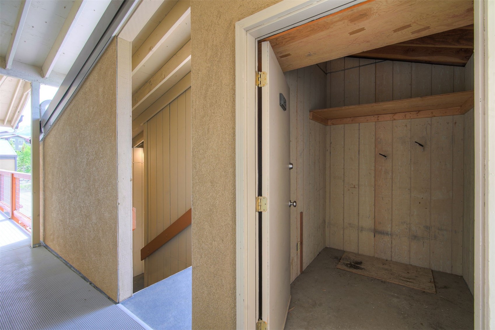 7031 Ryan Gulch Road, Unit 301 Silverthorne, CO 80498 - Photo 34 of 37 a view of a hallway with wooden floor