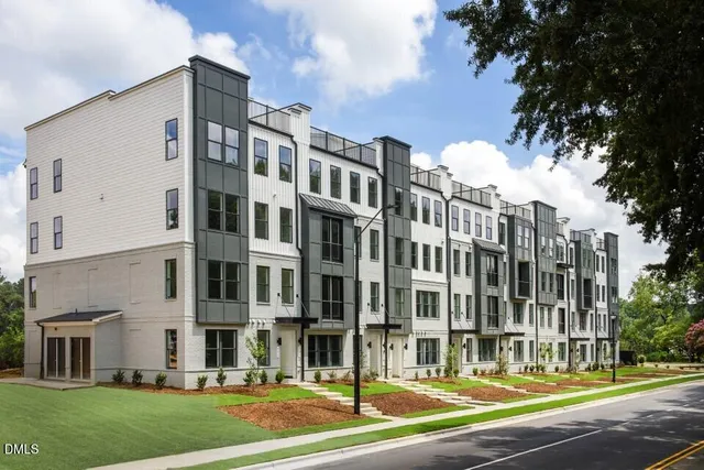 a view of a building with a yard