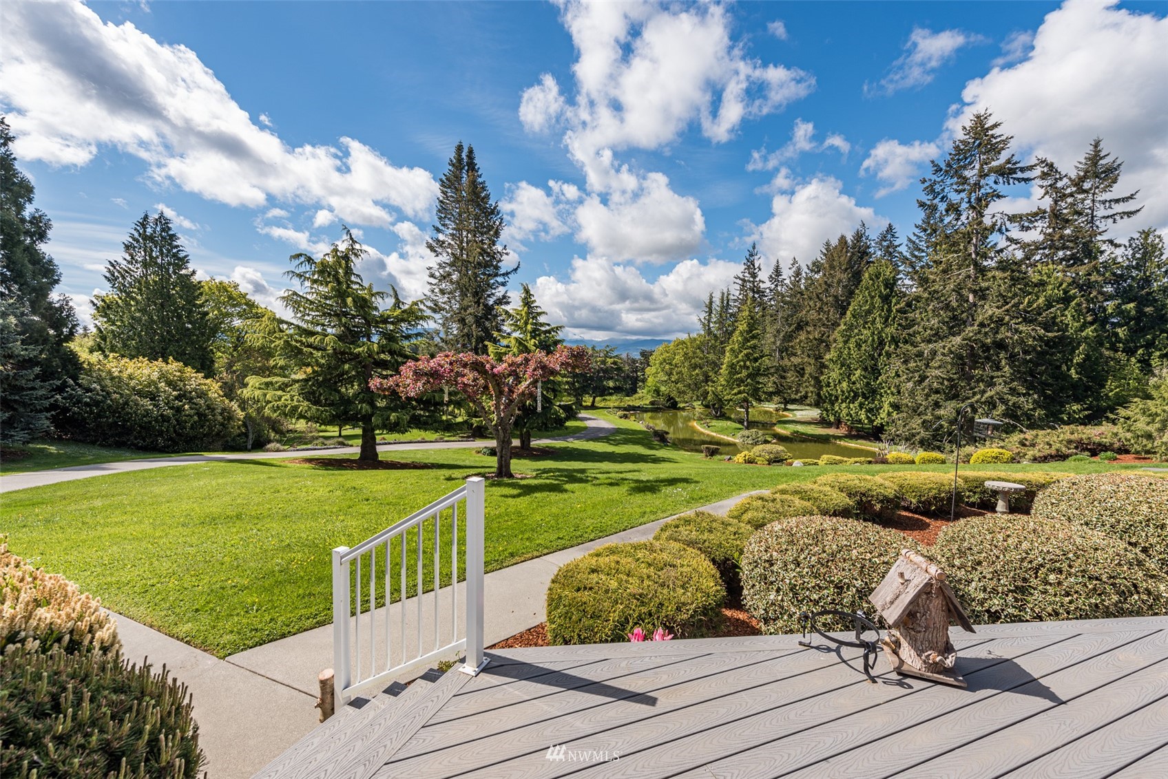 4949 Woodcock Road Sequim, WA 98382 - Photo 12 of 40 a view of a garden and trees