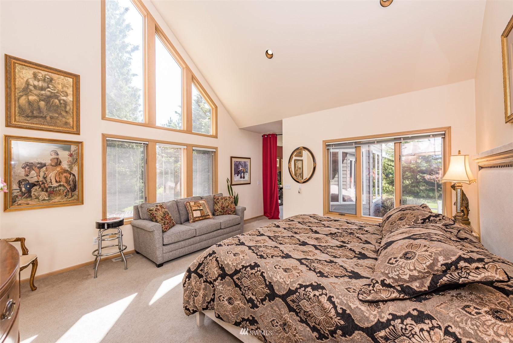 4949 Woodcock Road Sequim, WA 98382 - Photo 17 of 40 a bedroom with a bed couch and a large window
