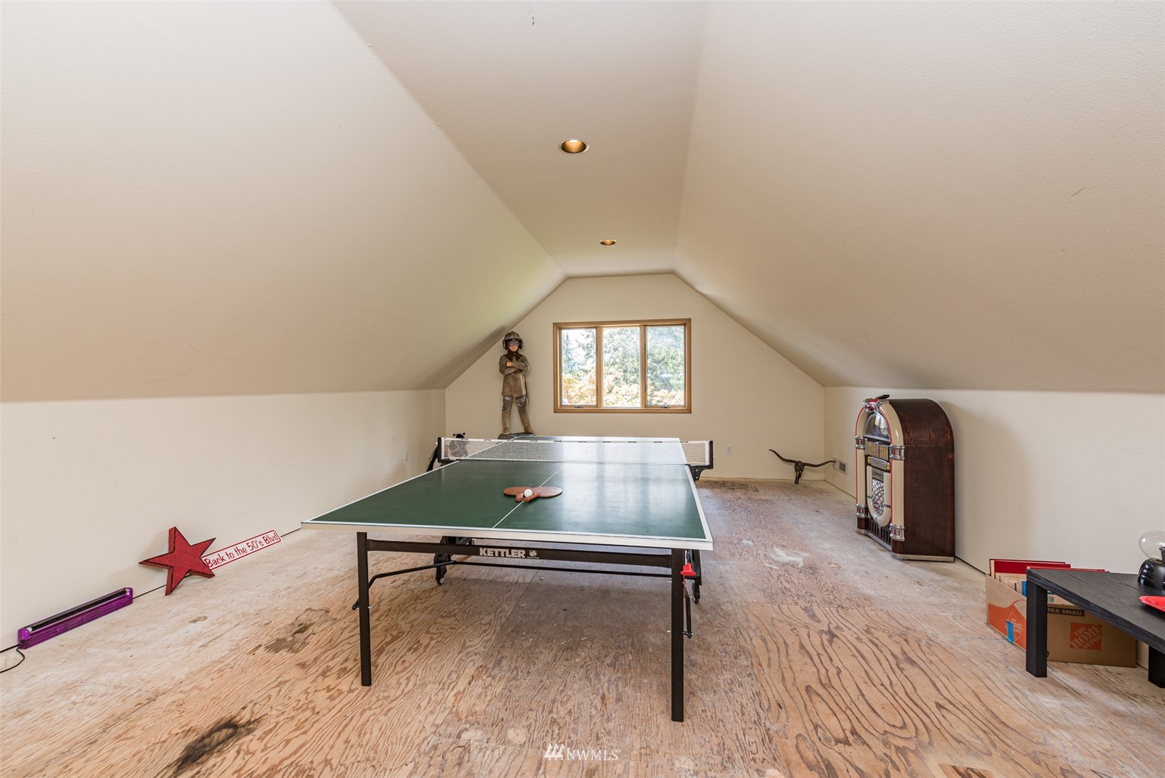 4949 Woodcock Road Sequim, WA 98382 - Photo 24 of 40 a living room with furniture and a wooden floor