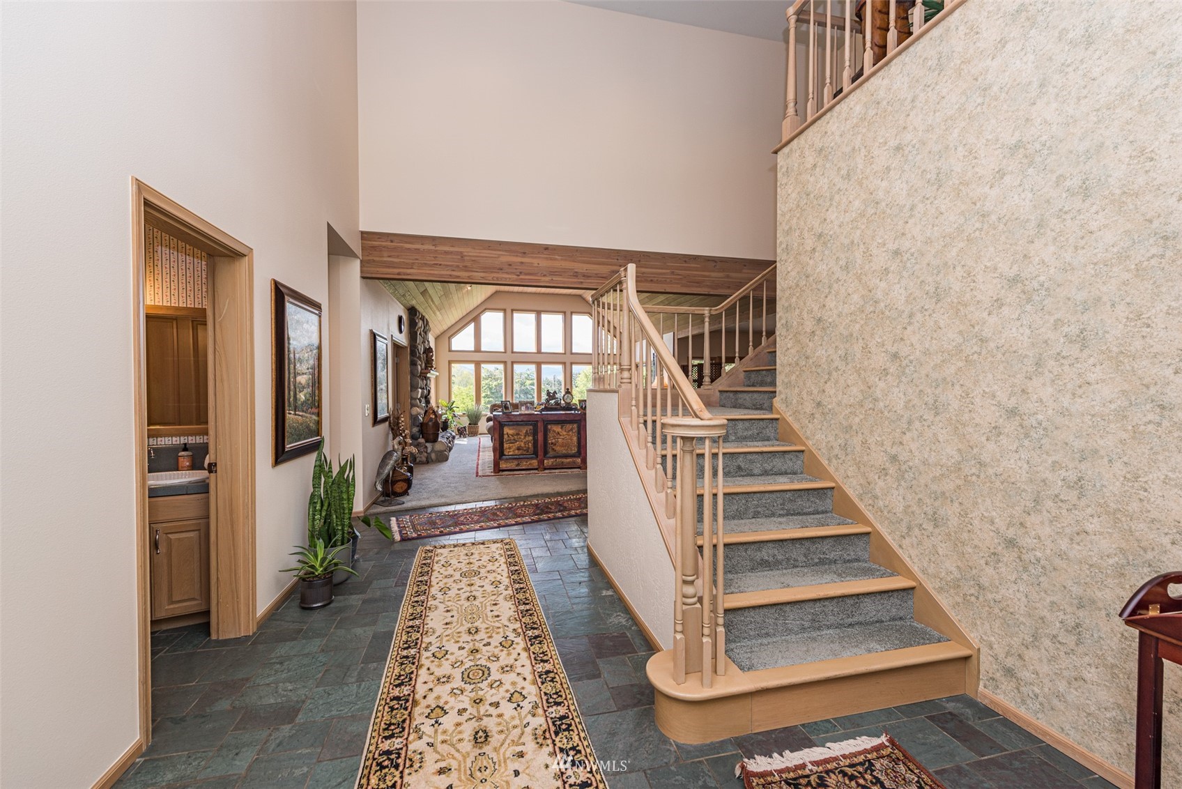 4949 Woodcock Road Sequim, WA 98382 - Photo 25 of 40 a view of entryway and hall with wooden floor