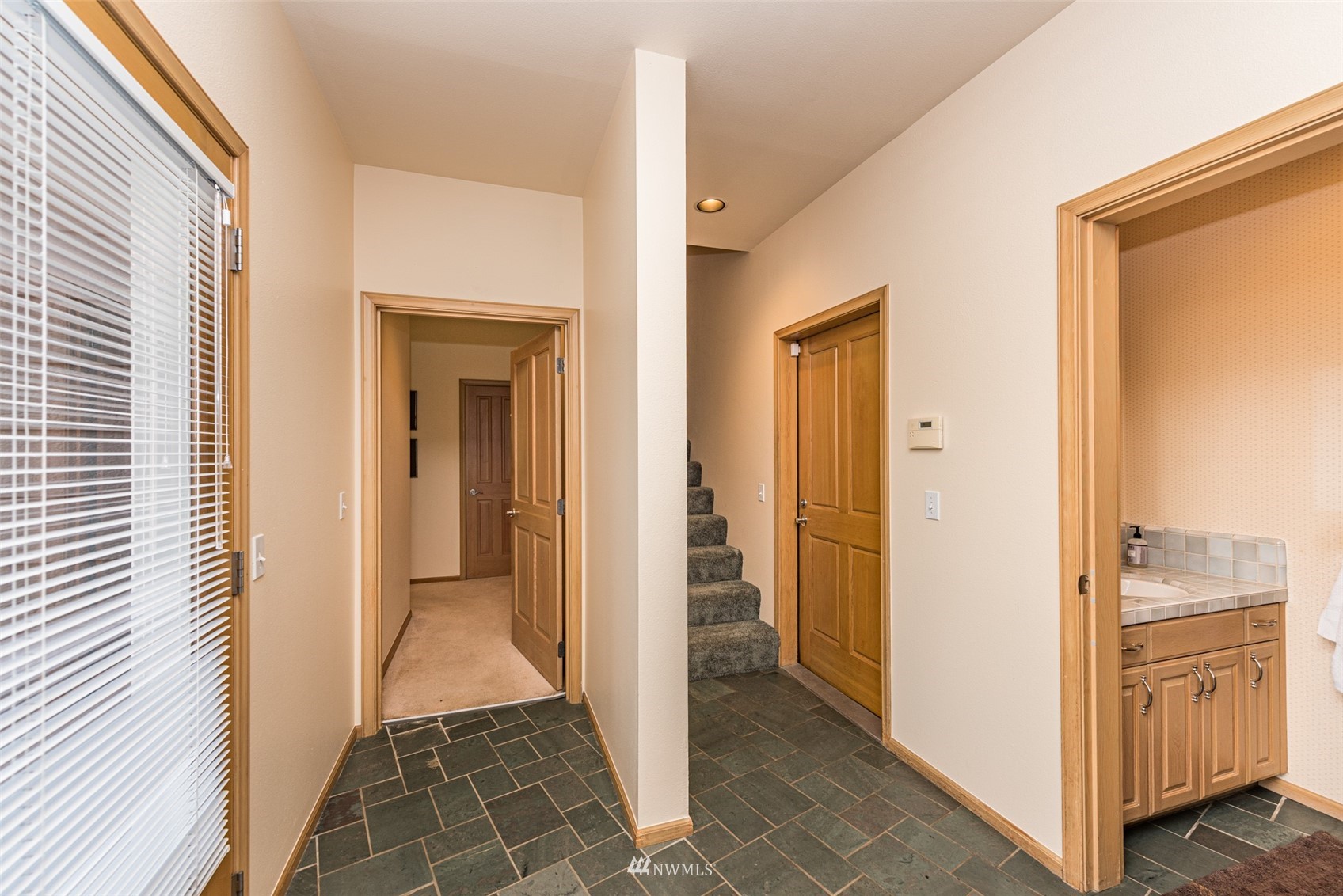 4949 Woodcock Road Sequim, WA 98382 - Photo 30 of 40 a view of a hallway with wooden floor and closet