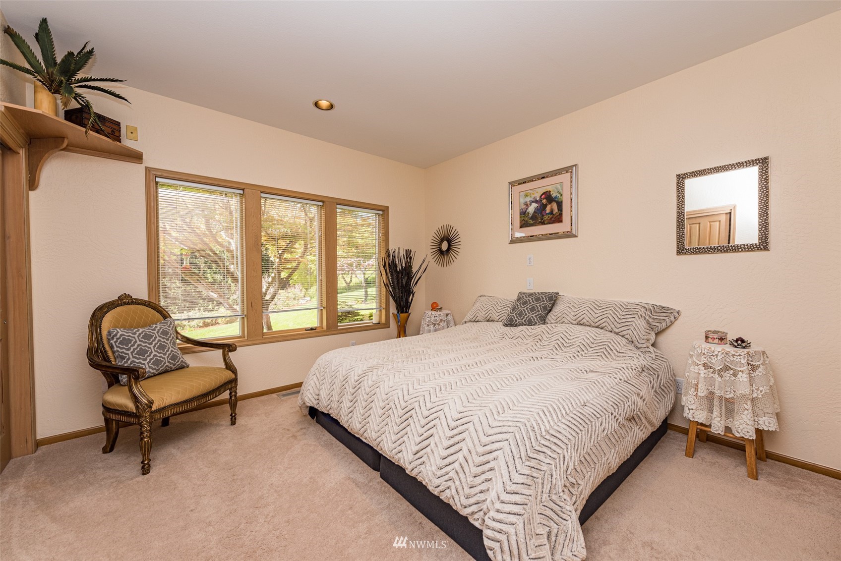 4949 Woodcock Road Sequim, WA 98382 - Photo 33 of 40 a bedroom with a bed and a couch