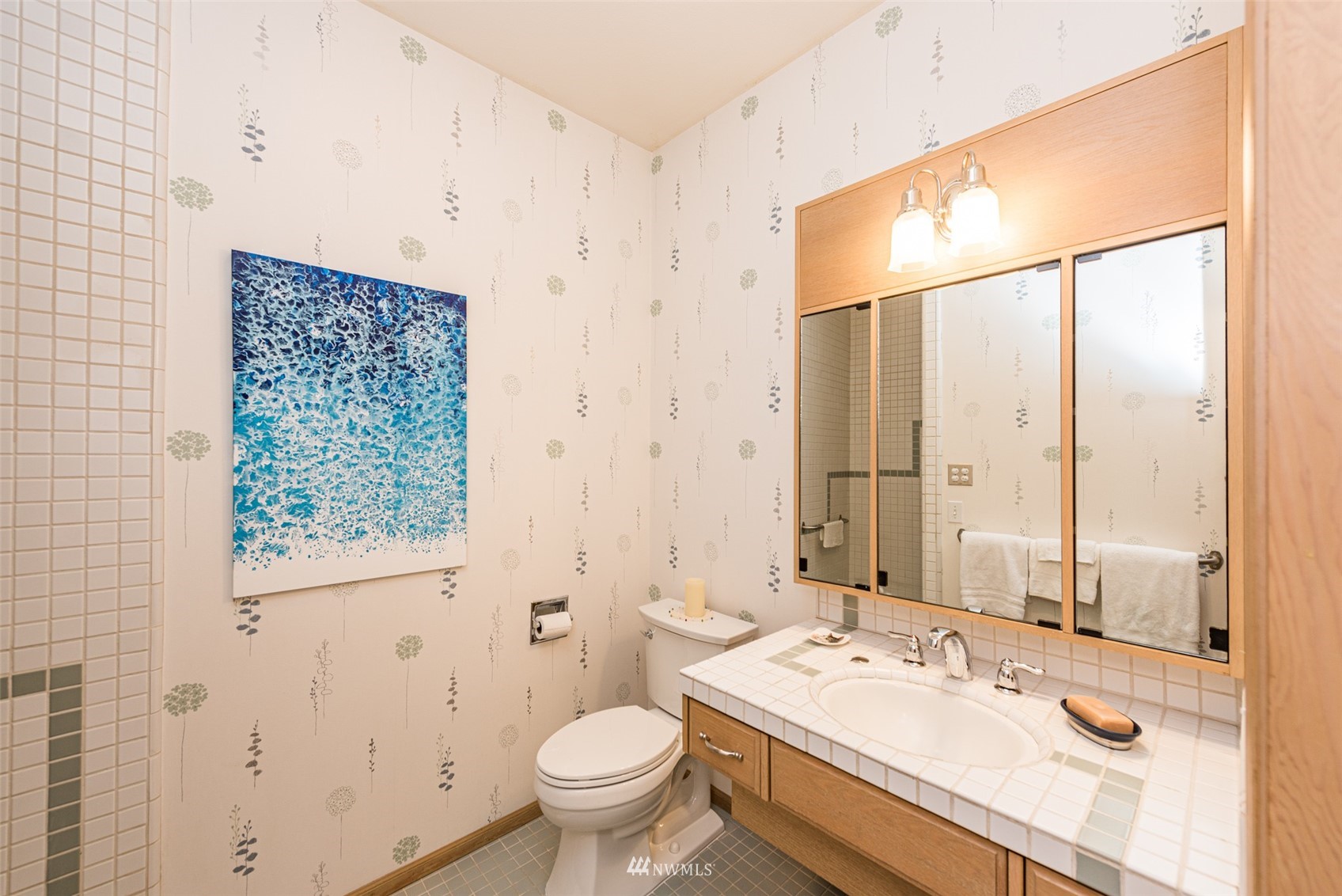 4949 Woodcock Road Sequim, WA 98382 - Photo 34 of 40 a bathroom with a sink toilet and shower