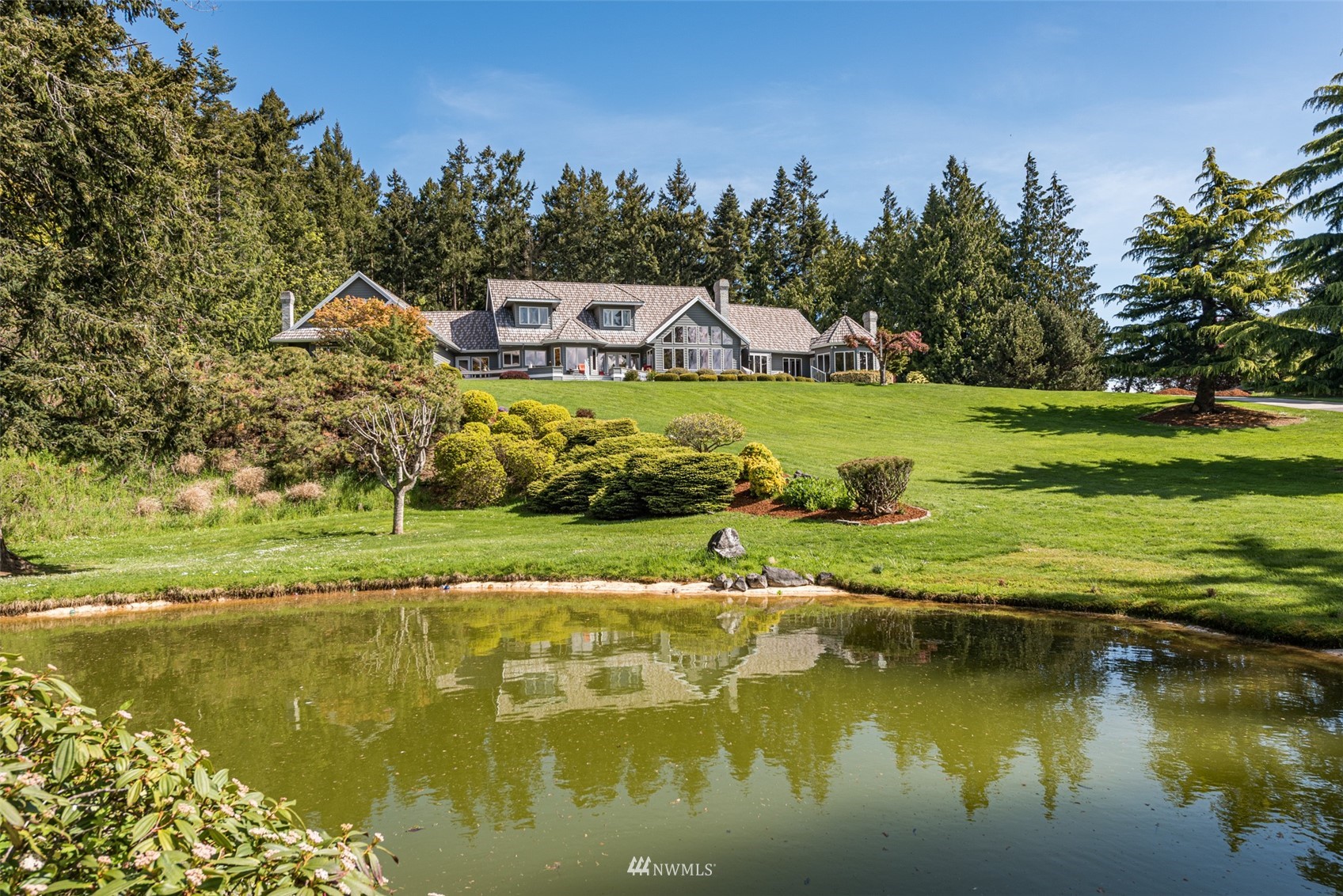 4949 Woodcock Road Sequim, WA 98382 - Photo 39 of 40 a view of a lake with houses
