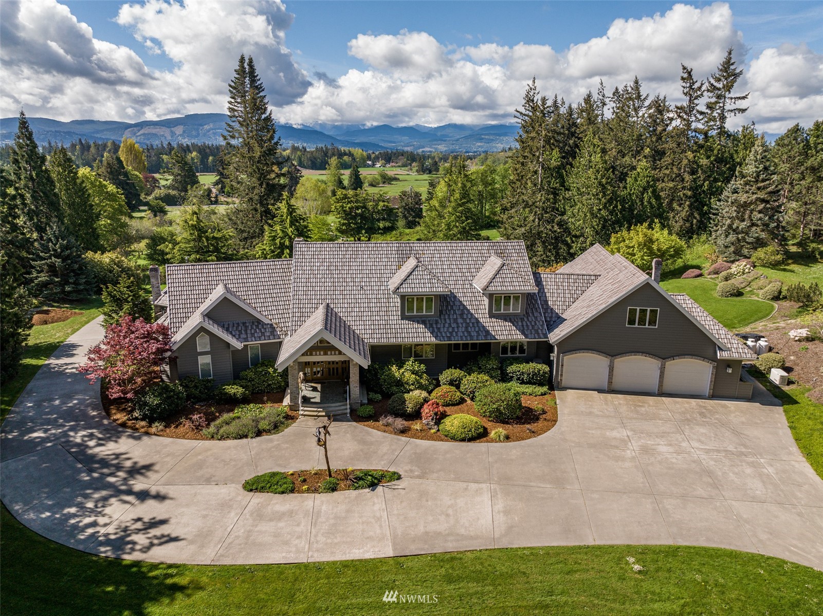 4949 Woodcock Road Sequim, WA 98382 - Photo 4 of 40 a aerial view of a house
