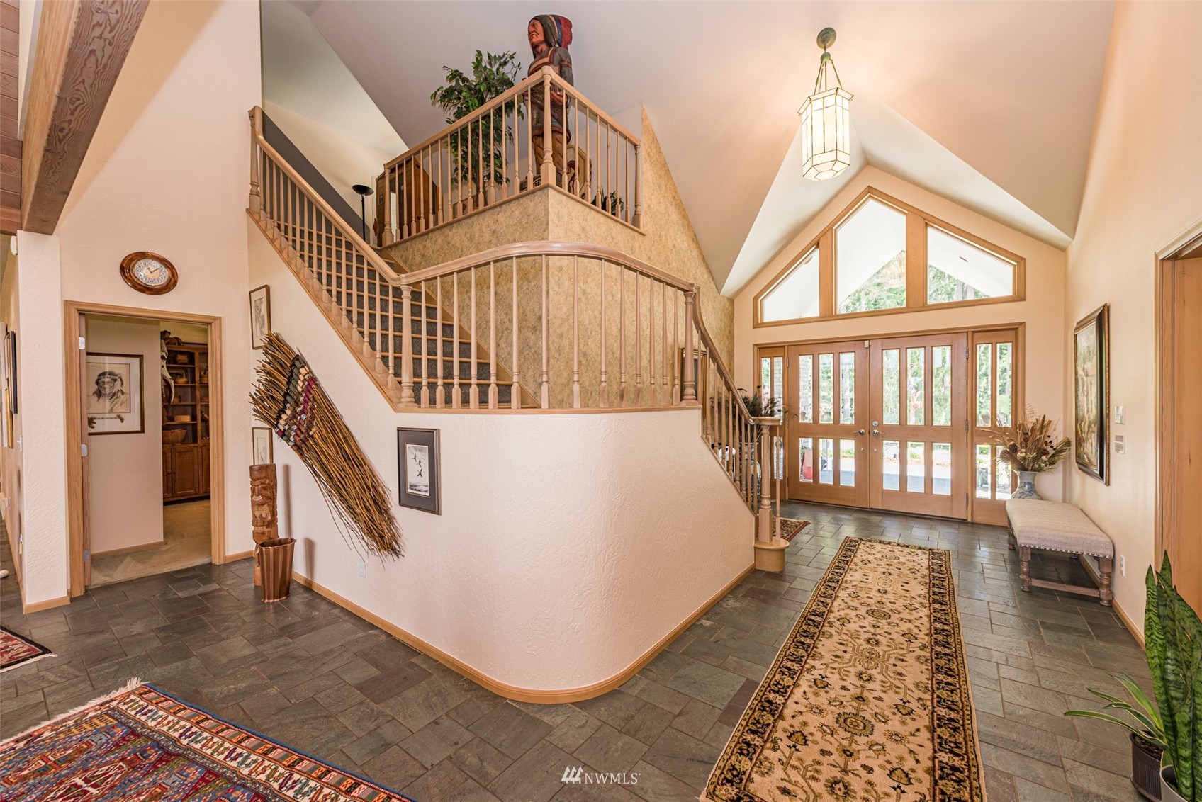 4949 Woodcock Road Sequim, WA 98382 - Photo 7 of 40 a view of a bedroom with wooden floor and windows