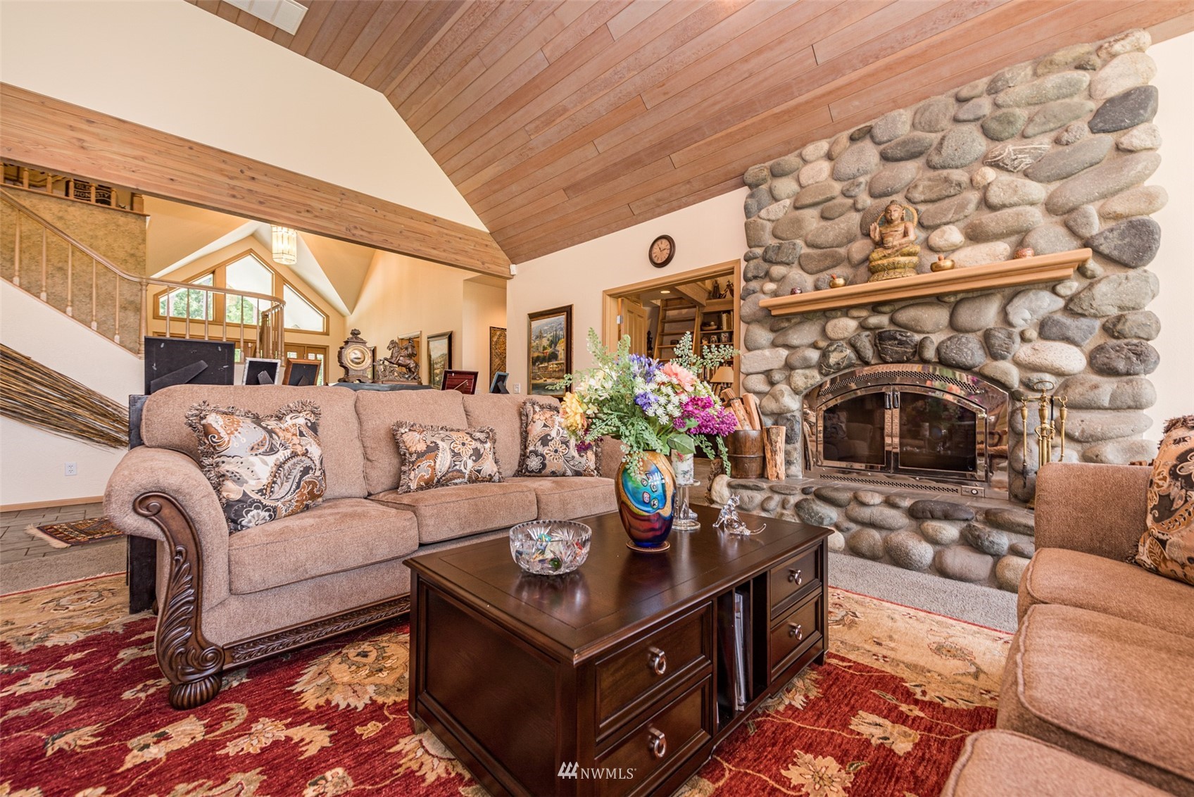 4949 Woodcock Road Sequim, WA 98382 - Photo 9 of 40 a living room with furniture and a fireplace