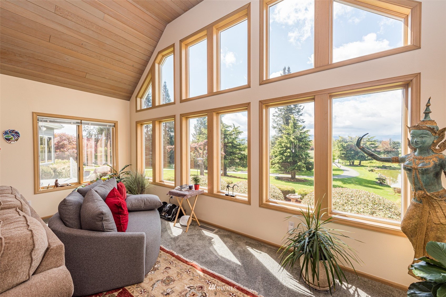 4949 Woodcock Road Sequim, WA 98382 - Photo 10 of 40 a living room with furniture and floor to ceiling windows