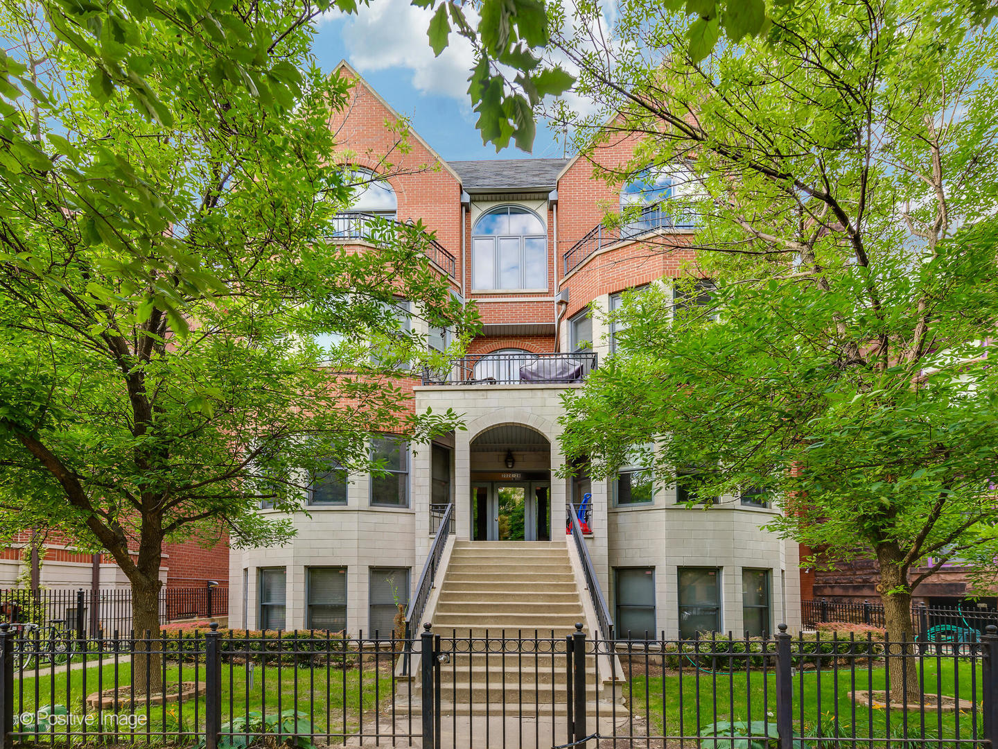 2026 West Pierce Avenue, Unit 7 Chicago, IL 60622 - Photo 1 of 1 front view of a brick house with a small yard