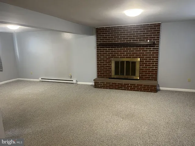 an empty room with a storage & utility room