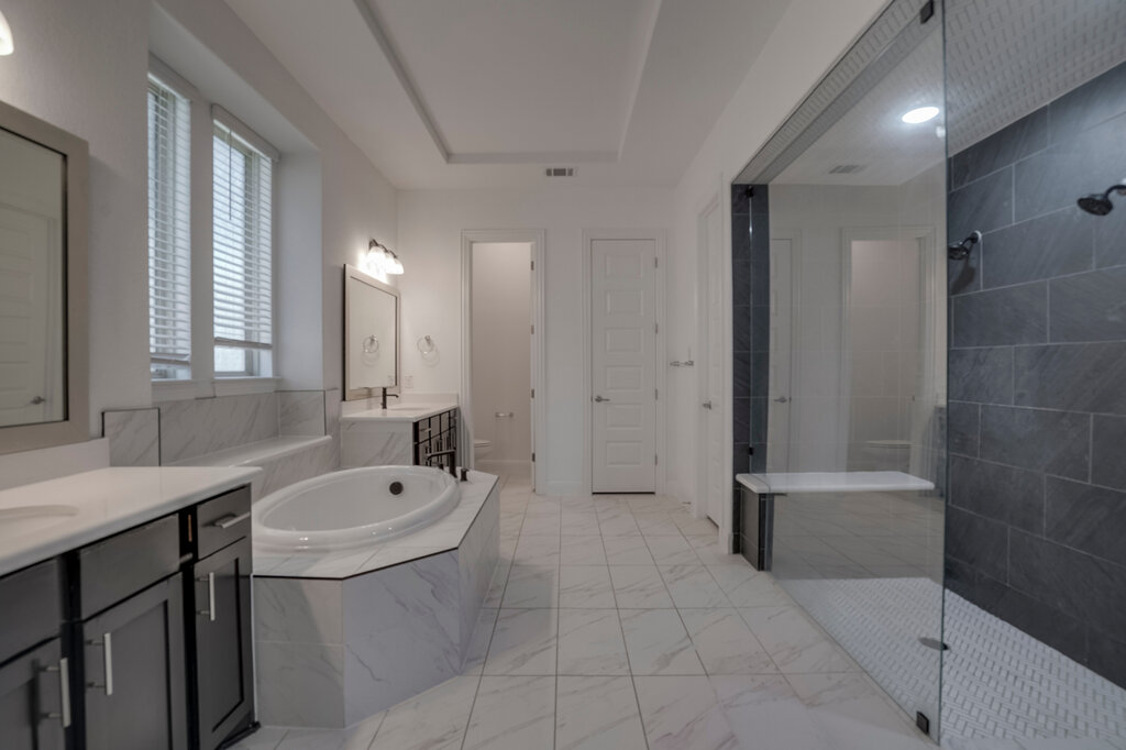 2920 Hadley Way Leander, TX 78641 - Photo 11 of 20 Indulge in a tranquil bathing experience in this generous bathroom, featuring a deep soaking tub and a spacious walk-in shower.