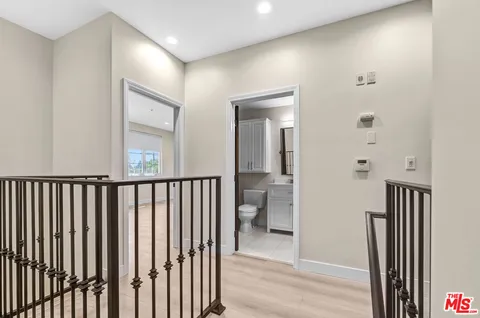 a view of a hallway with washer and dryer