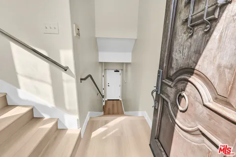 a large kitchen with a table and chairs