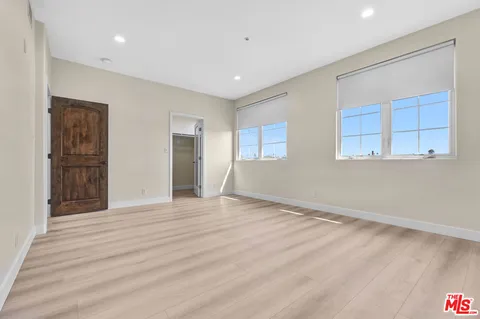 a bathroom with a granite countertop sink mirror and a bathtub