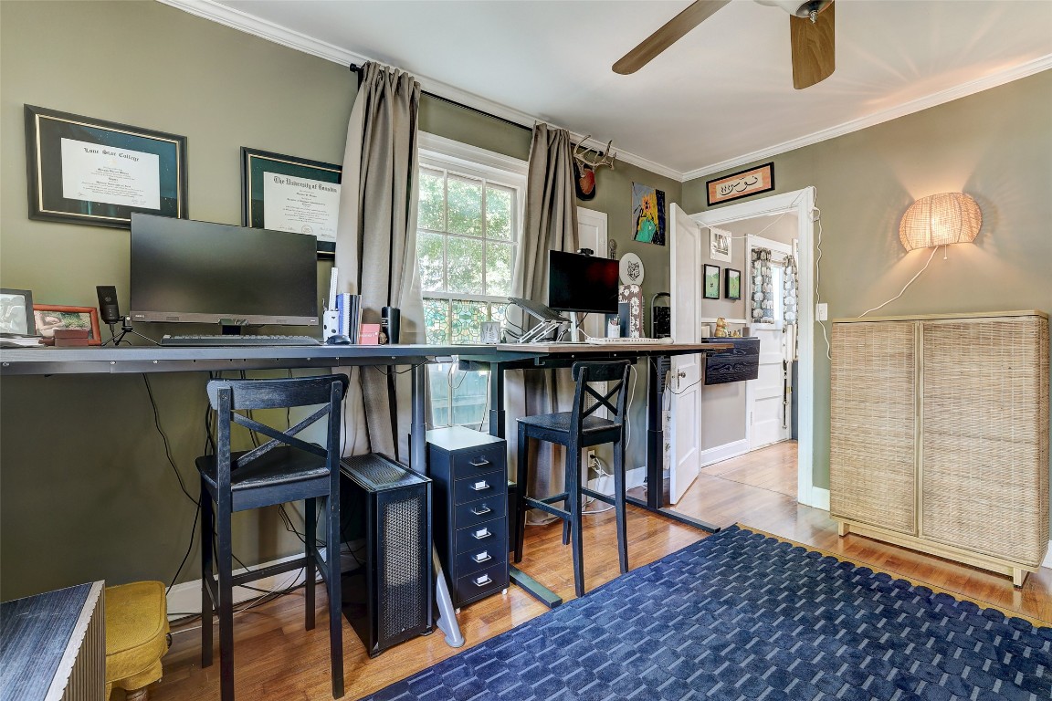 809 East 44th Street Austin, TX 78751 - Photo 21 of 40 Bar with ornamental molding, wood finished floors, and ceiling fan