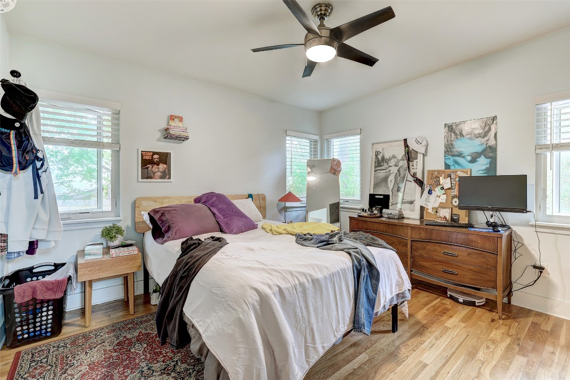 809 East 44th Street Austin, TX 78751 - Photo 34 of 40 Bedroom with ceiling fan and light wood-style floors