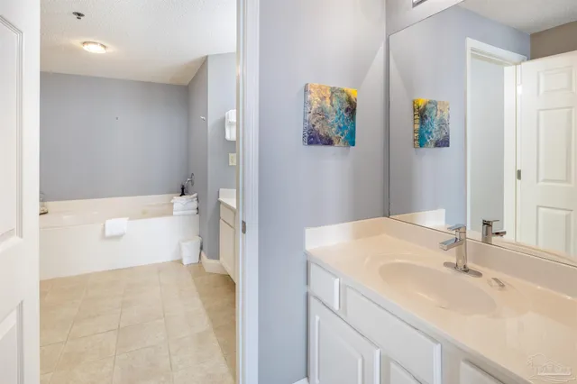 a en suite bathroom with a sink and mirror