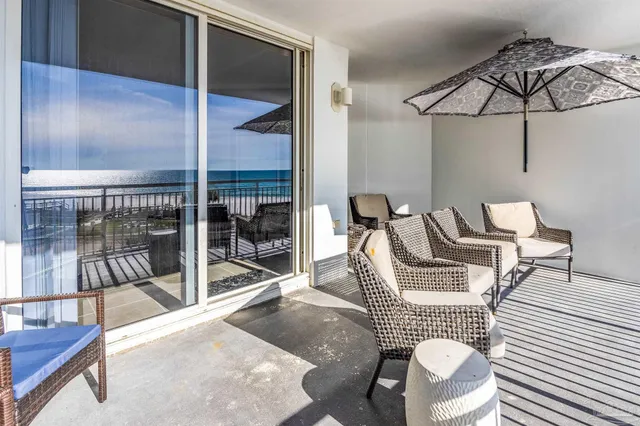a view of swimming pool with outdoor seating