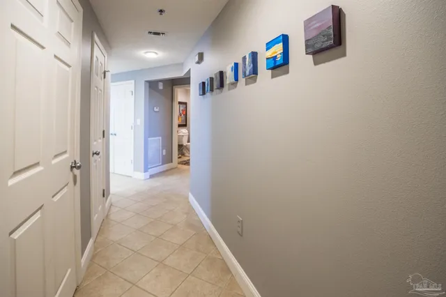 a kitchen with white cabinets sink and appliances