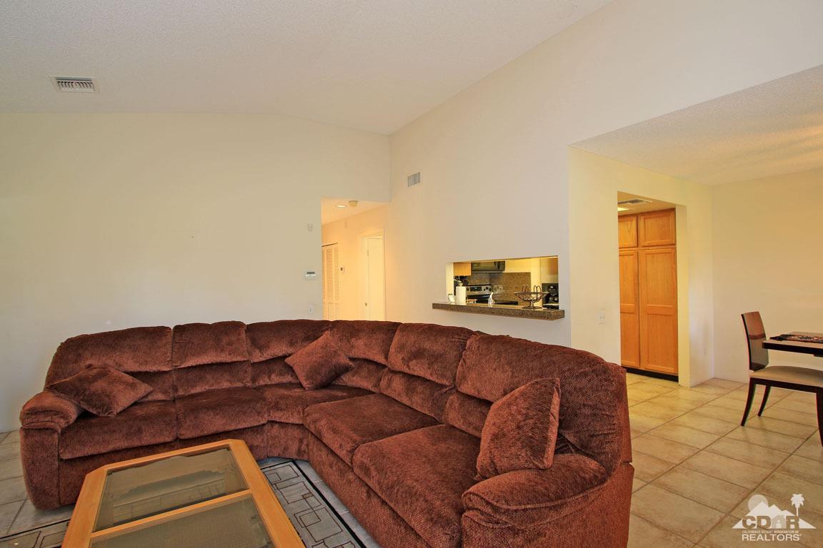 17 Mission Court Rancho Mirage, CA 92270 - Photo 11 of 37 a living room with a couch and a coffee table
