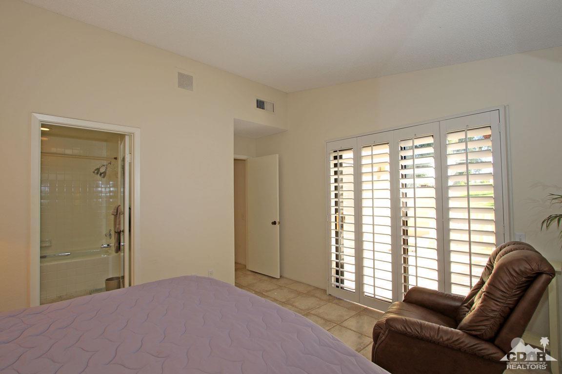 17 Mission Court Rancho Mirage, CA 92270 - Photo 21 of 37 a bedroom with furniture and windows