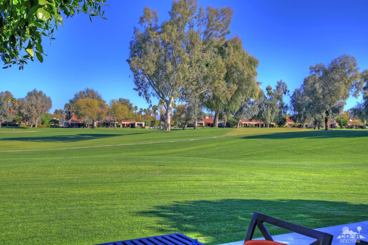 17 Mission Court Rancho Mirage, CA 92270 - Photo 28 of 37 a grassy field with trees in the background