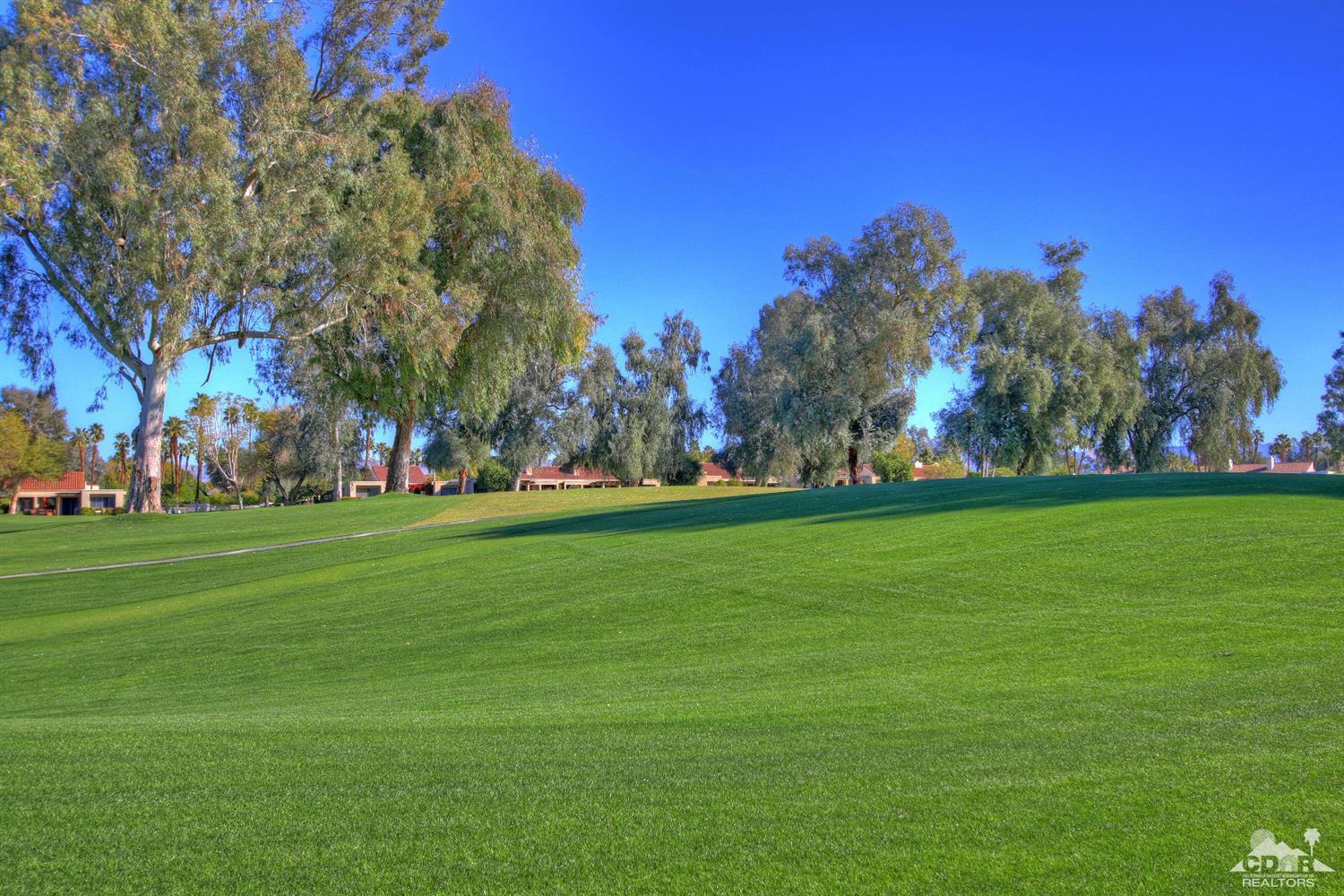 17 Mission Court Rancho Mirage, CA 92270 - Photo 33 of 37 a view of field with trees in the background