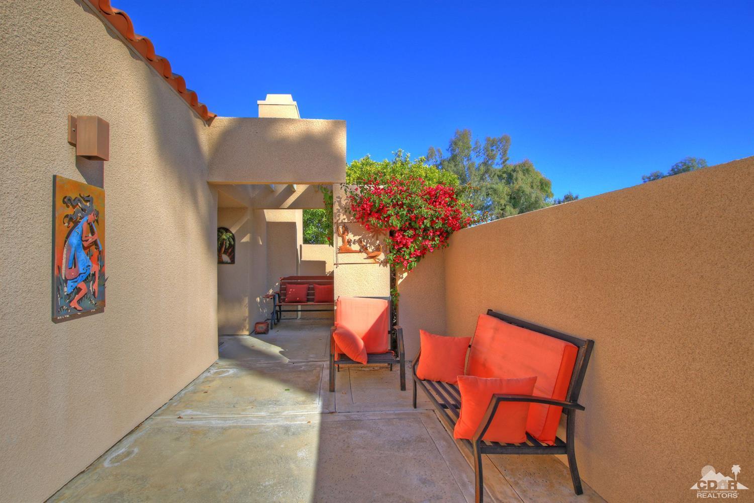 17 Mission Court Rancho Mirage, CA 92270 - Photo 6 of 37 a view of a chairs in front of a building