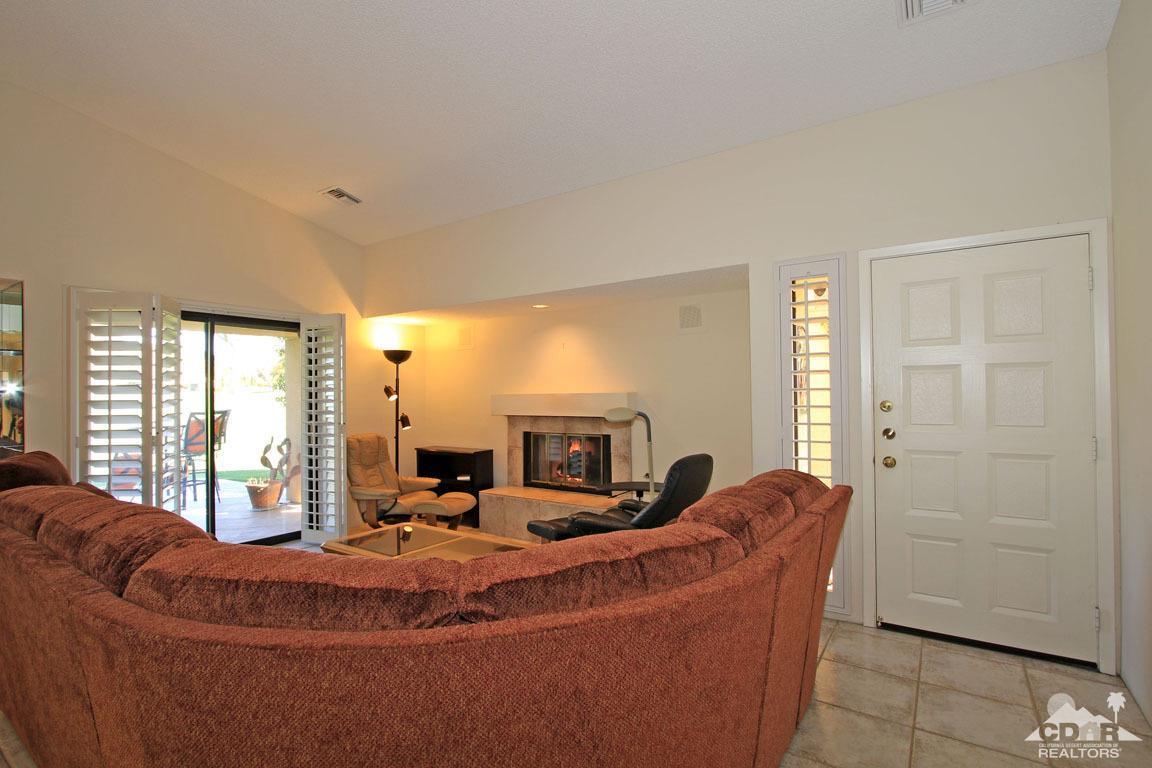 17 Mission Court Rancho Mirage, CA 92270 - Photo 8 of 37 a living room with furniture and a fireplace