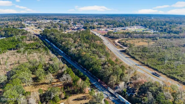 an aerial view of city and lake