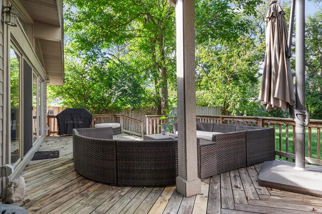 a view of a house with a yard and sitting area