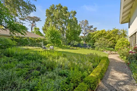 a backyard of a house with lots of green space