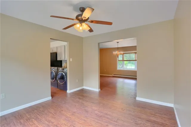 a kitchen with stainless steel appliances granite countertop a sink a stove and refrigerator
