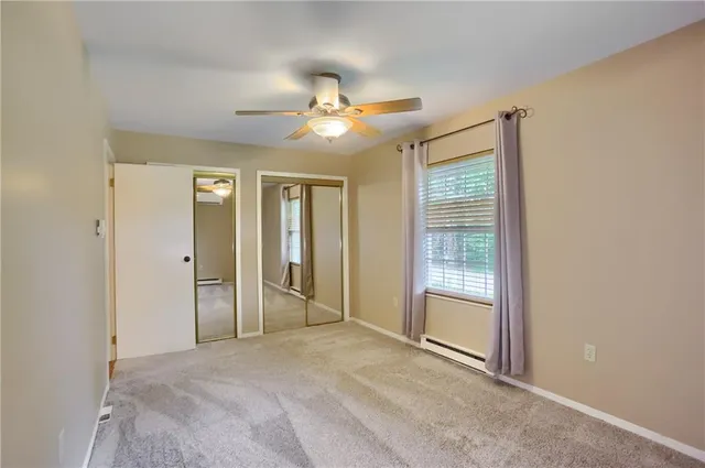a bathroom with a sink toilet and mirror