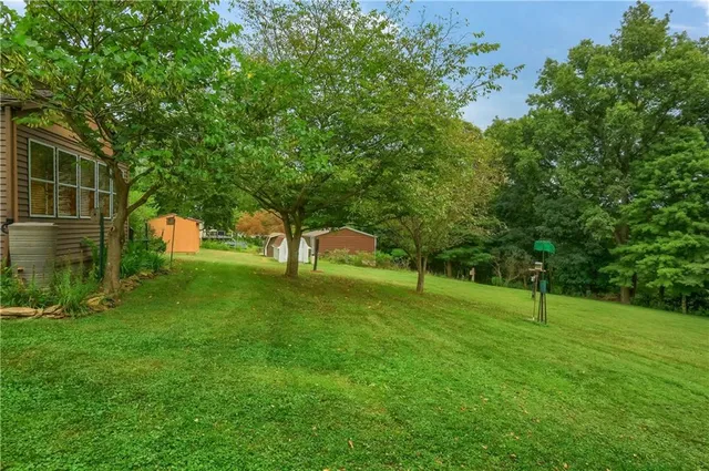 front view of a house with a garden