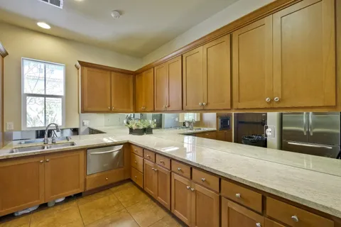a kitchen with a sink and cabinets