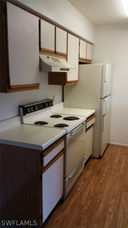 5317 Summerlin Road, Unit 1716 Fort Myers, FL 33919 - Photo 2 of 5 a kitchen with stainless steel appliances granite countertop a sink a stove and a refrigerator