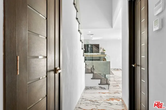 a bedroom with a bed and a walk in closet