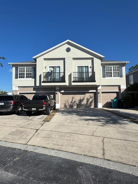 a view of a car park in front of house