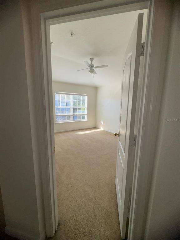 6404 South Goldenrod Road, Unit 2A Orlando, FL 32822 - Photo 13 of 21 a view of an empty room with a window
