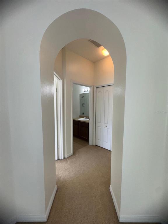 6404 South Goldenrod Road, Unit 2A Orlando, FL 32822 - Photo 14 of 21 a view of a big room with closet and windows