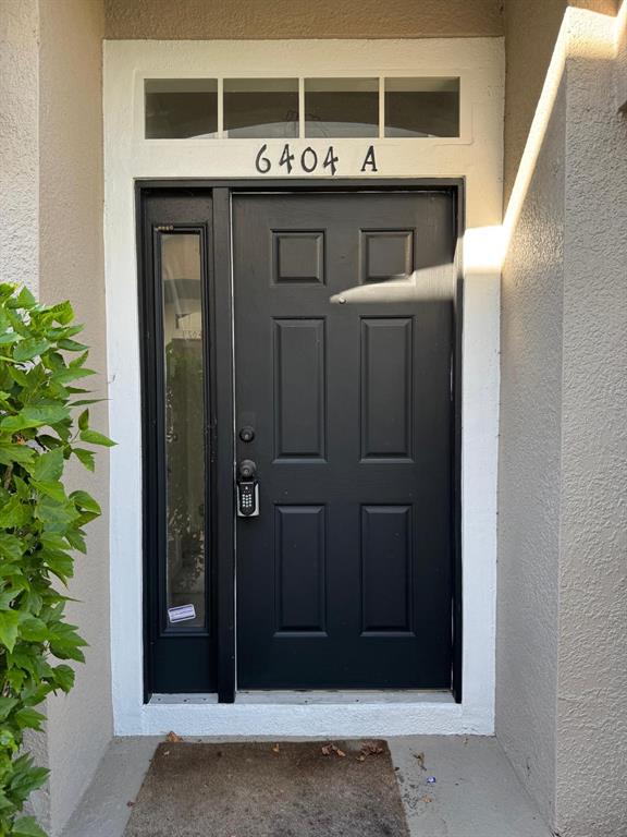 6404 South Goldenrod Road, Unit 2A Orlando, FL 32822 - Photo 4 of 21 a front view of a house with a garage