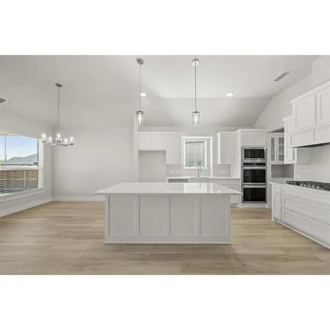 a view of kitchen with wooden floor