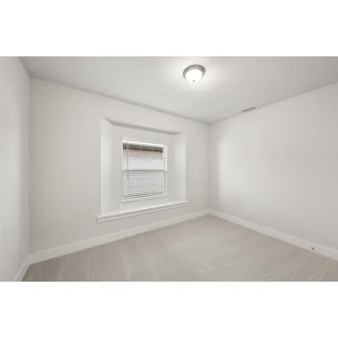 a black and white photo of a living room
